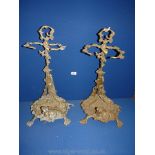 A pair of Brass umbrella/stick Stands having four spade feet with a hunting horn,