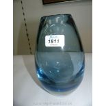 A heavy blue glass vase, 8'' tall.
