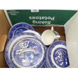 A box of blue/white Willow pattern china including four cups, twelve saucers, ten side plates,