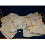 A quantity of white linen tablecloths, sheets and napkins etc including lace work,