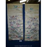 A pair of delicate oriental silk Wall Hangings with blossom, herons, birds and butterflies detail,