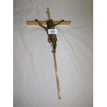 A heavy brass Crucifix of unusual design, with a die-cast figure of Christ,