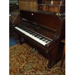 A presentable Mahogany cased Upright Piano by "Firth Bros.