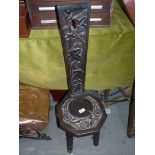 A nicely carved octagonal seated Arts and crafts Spinning Chair decorated with trailing flowering