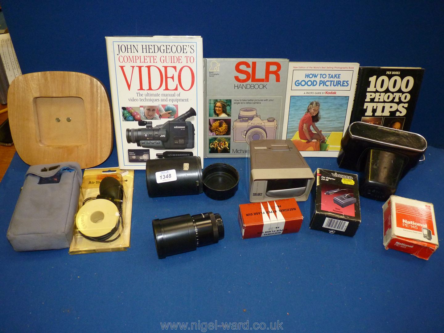 A quantity of photographic items including a Zenit E 35mm SLR Camera with a Helios 58mm f/2 Lens,