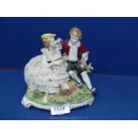 Two Unter Weiss Bach lace porcelain models of couples with the gent standing.