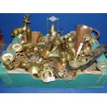 A large quantity of brass including horse brasses, candlesticks. deer figure, etc.