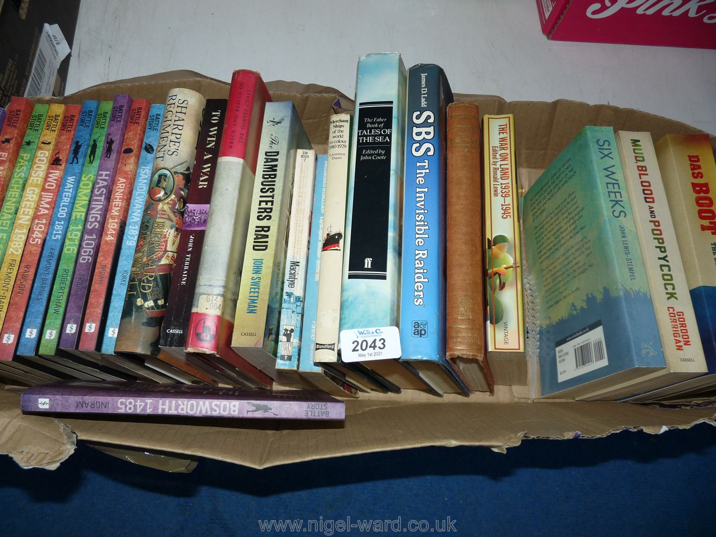 A box of books to include; 10 Battle story books, SBS The Invisible Raiders,