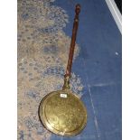 A brass bed warming pan (with damaged handle)