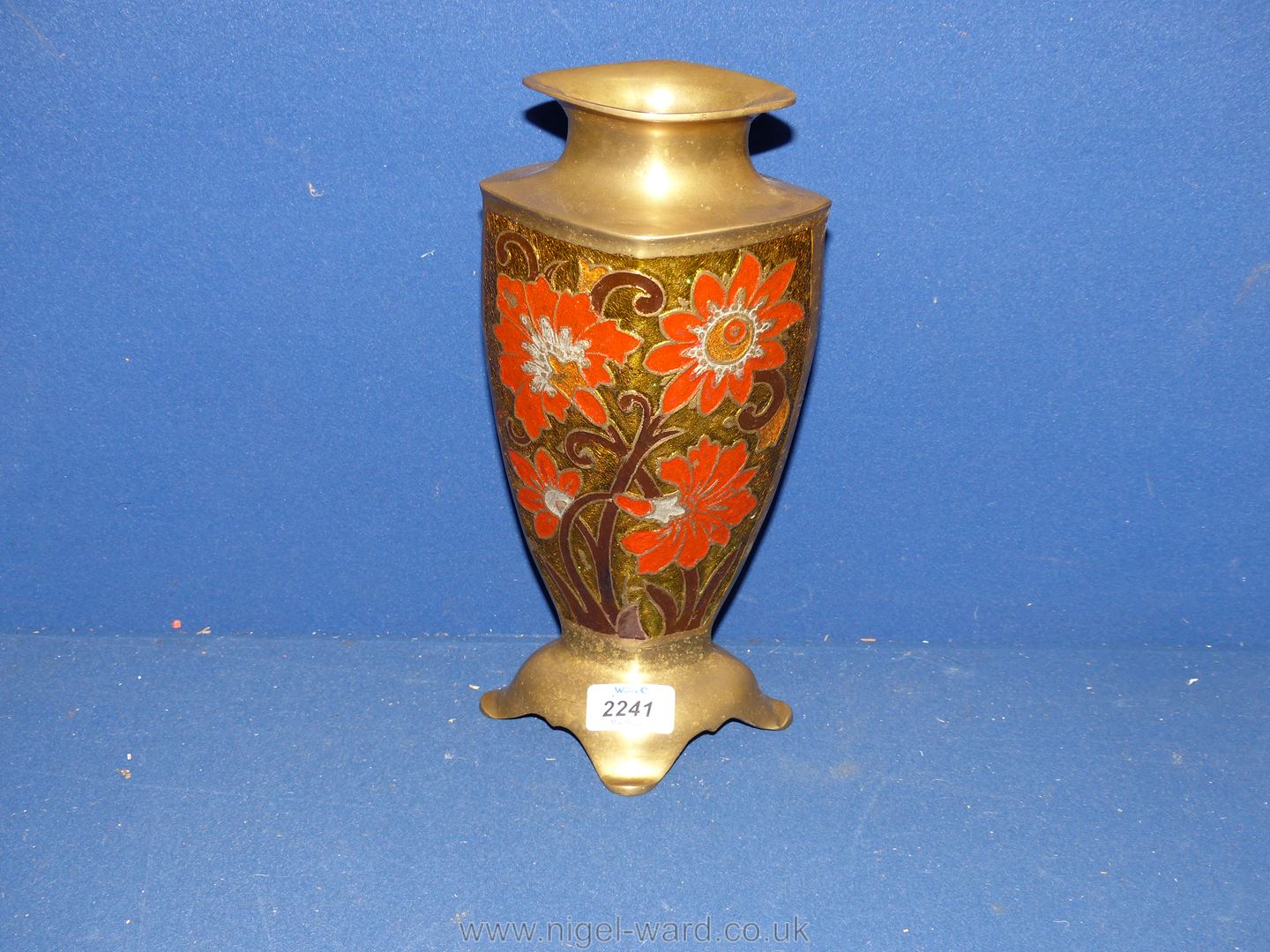 A tall enameled brass Vase, decorated with red flowers. 11 1/2" tall.