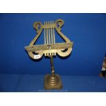A Lyre shaped Brass adjustable music stand, 20'' tall.