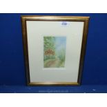 A small framed and mounted Watercolour of a Floral garden with a path disappearing into the