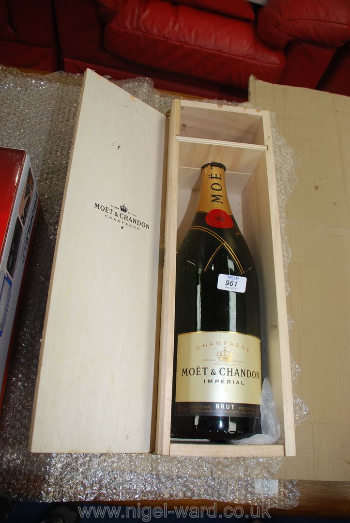 An empty bottle of Moet and Chandon in original wooden case.