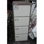 A four drawer Vickers Trimline filing cabinet and key.