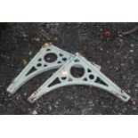 A pair of heavy wrought iron brackets, 24" x 24", fixings a/f.