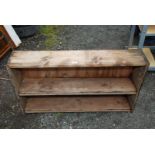 A two shelf wooden unit, 44" x 25" x 9" deep.