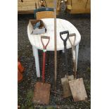 Three shovels and a rake.