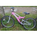 A Trax TF51 18 speed pink bicycle.