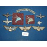 Three WWII Parachute Regiment cap badges, two patches, shoulder title,