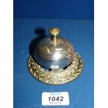 A vintage Desk Bell with cast brass base.