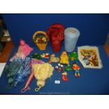 A box of assorted tassels, salt dough items, a bird embroidery and knitting cones.