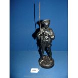 A cast metal figure of a Boy with fishing rod, 14'' tall.