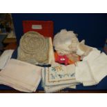 A quantity of linen including lace doilies, tablecloths, napkins etc.