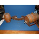 A wooden yoke and a small wooden and metal barrel and a pottery barrel.