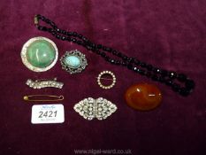 Miscellaneous brooches including polished stone, bar etc and a black jet necklace.