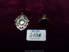 An antique silver/gold shield Fob, Birmingham 1870, together with a 9 ct.