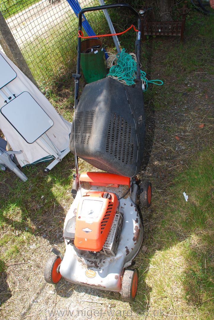 A Flymo Quicksilver 40 petrol mower.