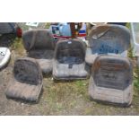 Five various tractor Seats.