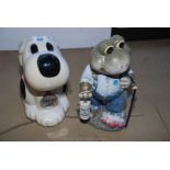 A Help the Aged frog figure and a dogs cookie jar.