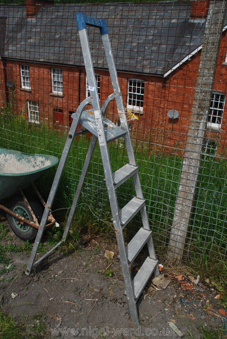 A four ring aluminium step ladder.