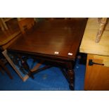 A square extending draw leaf dining table.