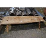 A Primitive oak Pig Bench, 38'' long, 14'' tall, depth varying from 12'' - 16''.