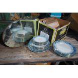 A quantity of blue and white plates, mirror and picture frames.