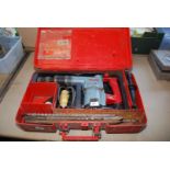 A box Hilti TE72 drill with drill bits.