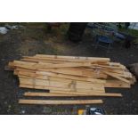 A quantity of various used timber and boards.
