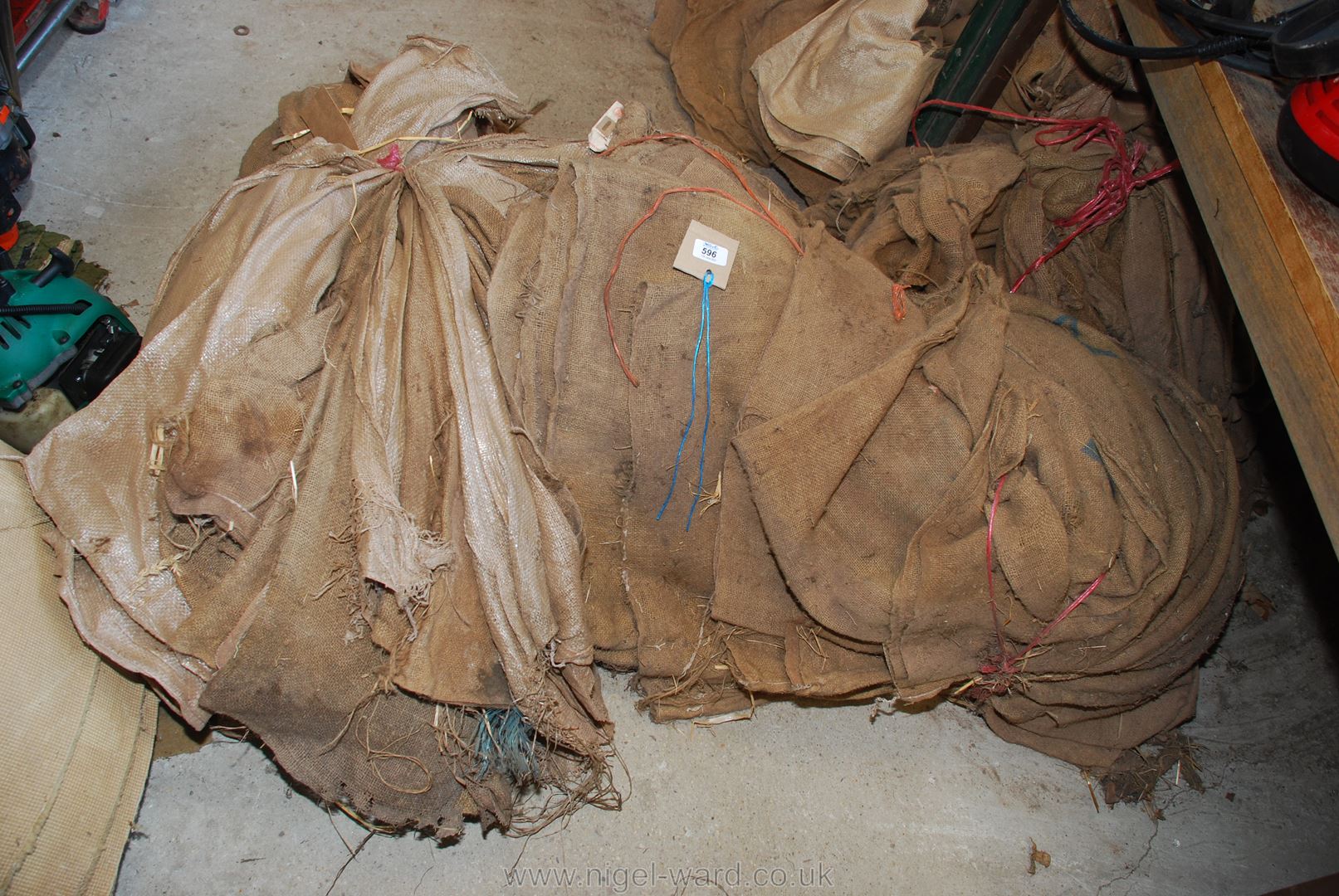Three bundles of hessian sacks.