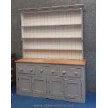 A three drawer over two cupboard dresser painted in Farrow & Ball 'French Grey' with natural pine