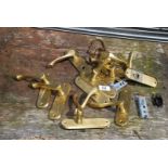 A quantity of brass door handles, etc.