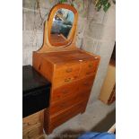 A four small over three large mirror backed chest of drawers, 30" x 16" x 63" tall.