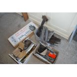 A box of various shelf brackets, twin gas burner, gate hinges, window furniture etc.