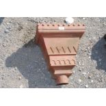 A large cast rainwater hopper.