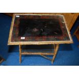 A glazed top bamboo table.