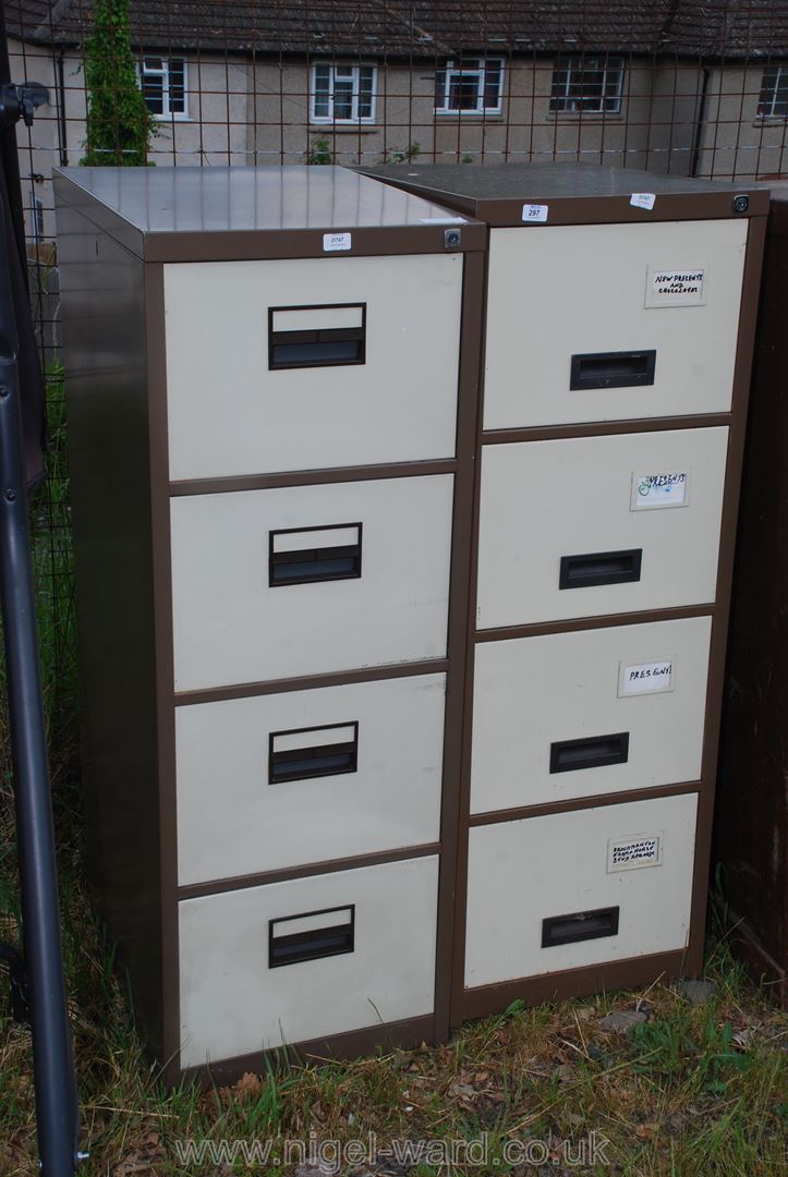 Two four drawer metal filing cabinets.