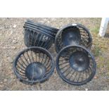 Eight black plastic hanging baskets, 14'' diameter, mostly with chains.
