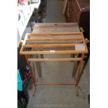 A pine towel rail/dryer and a large wooden school desk.