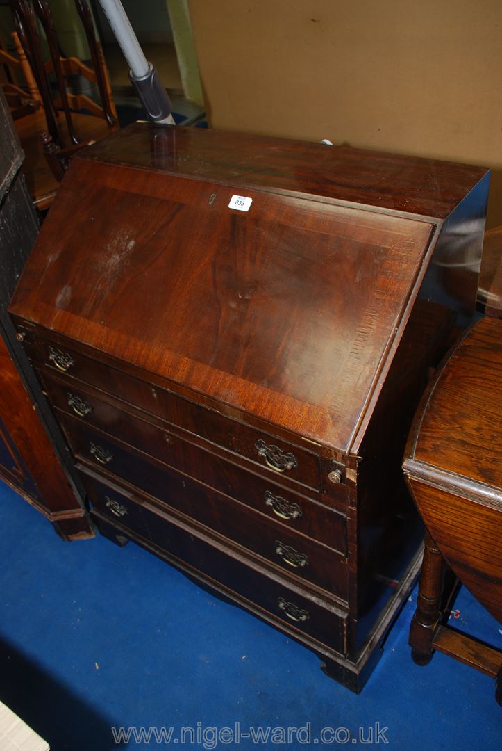 A four drawer writing bureau with fitted interior.